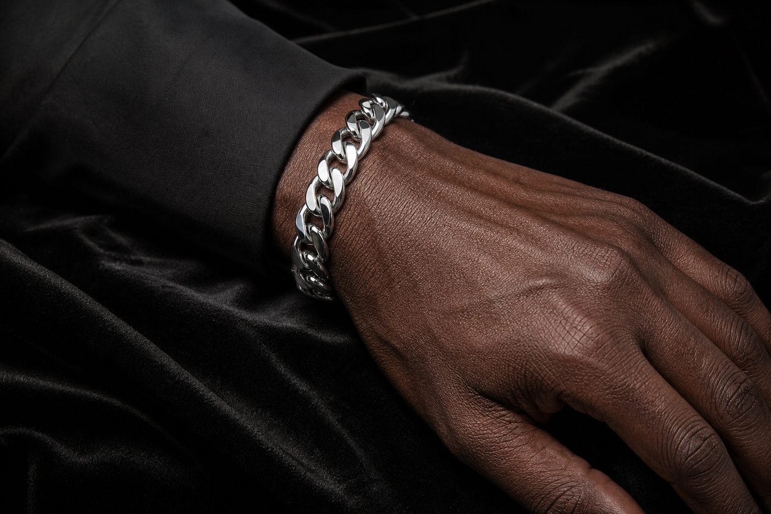 Silver Cuban bracelet worn on hand — NeverTarnish